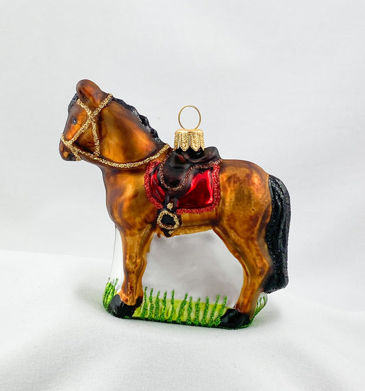Brown horse with red saddlecloth