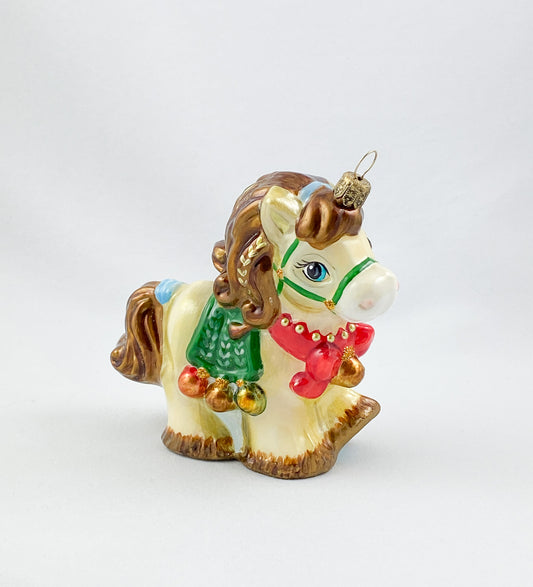 little horse with red ribbon