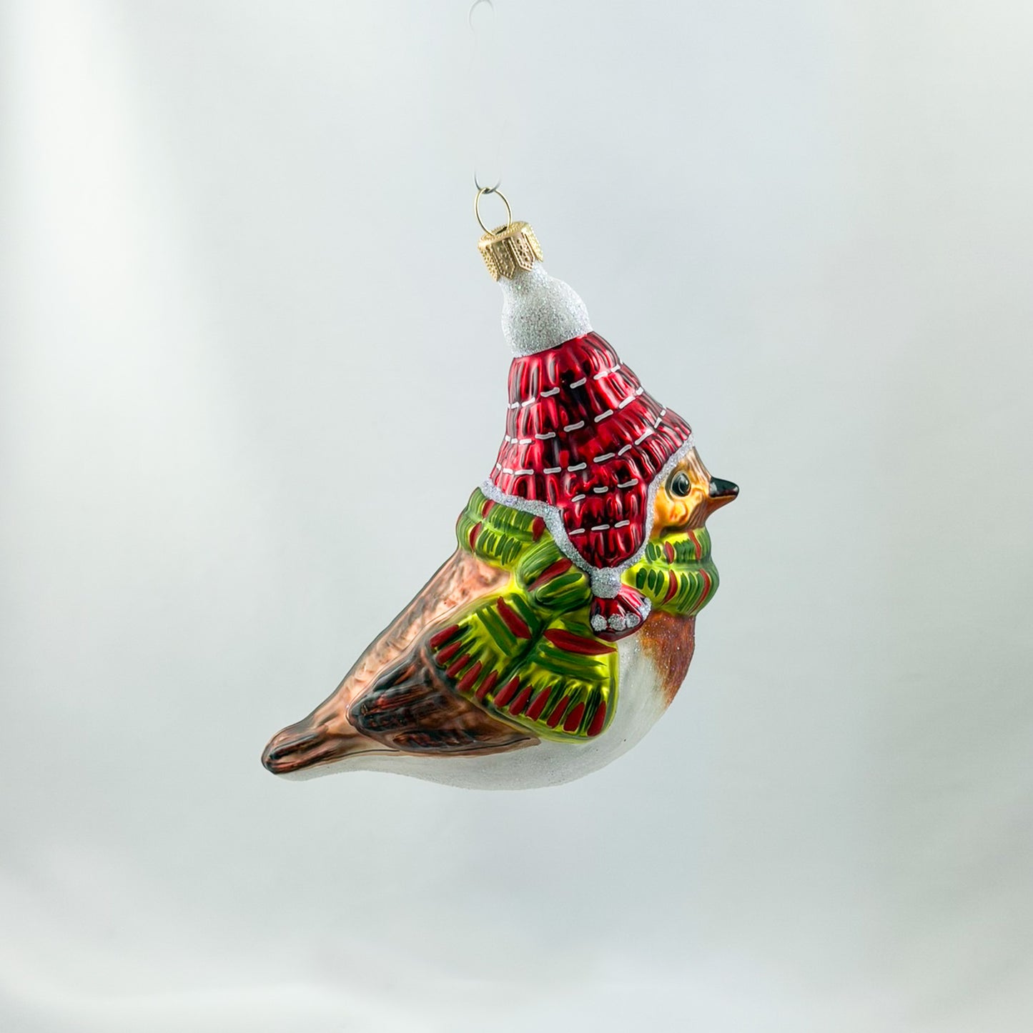 Robin with red hat and green scarf