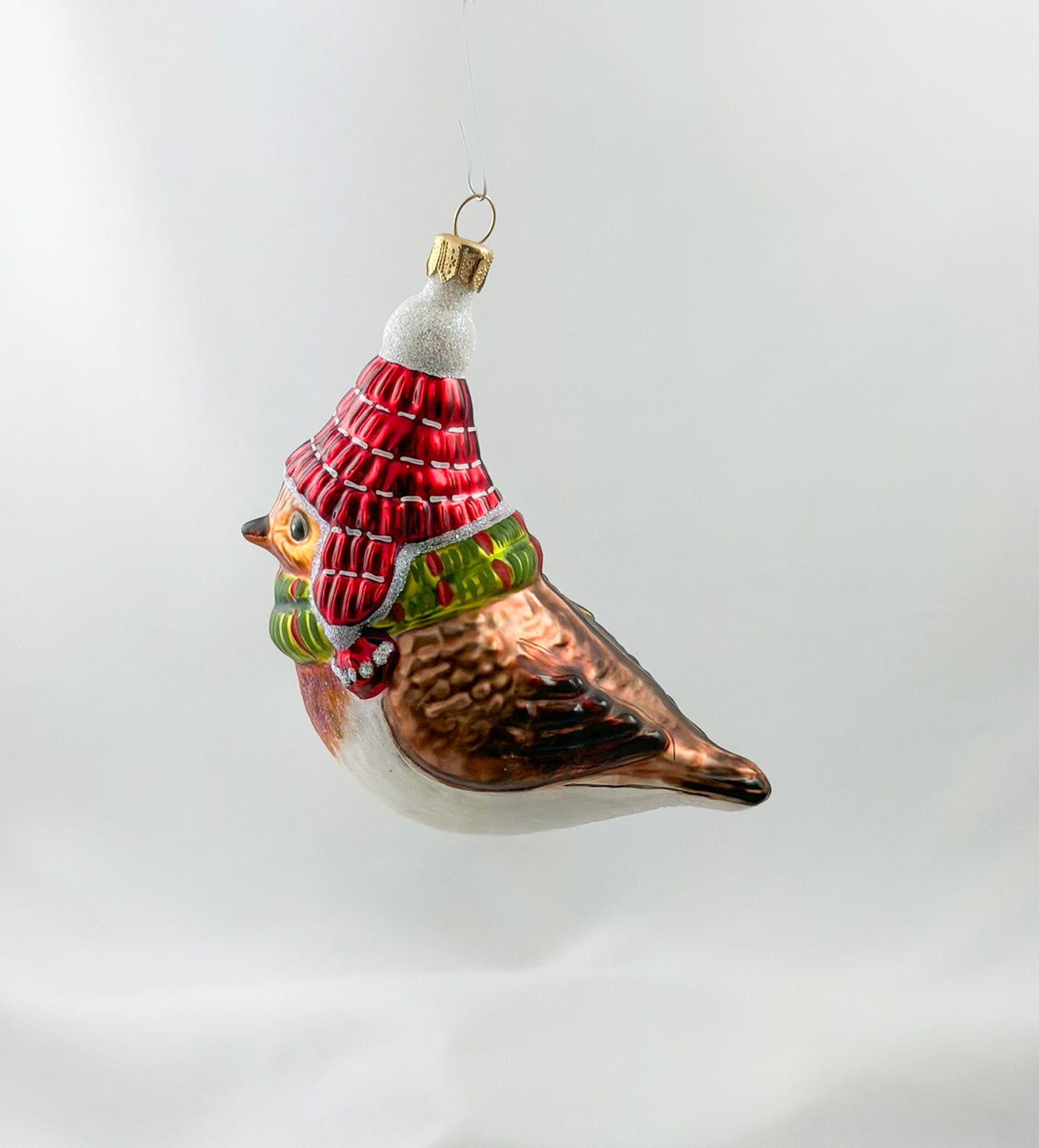 Robin with red hat and green scarf