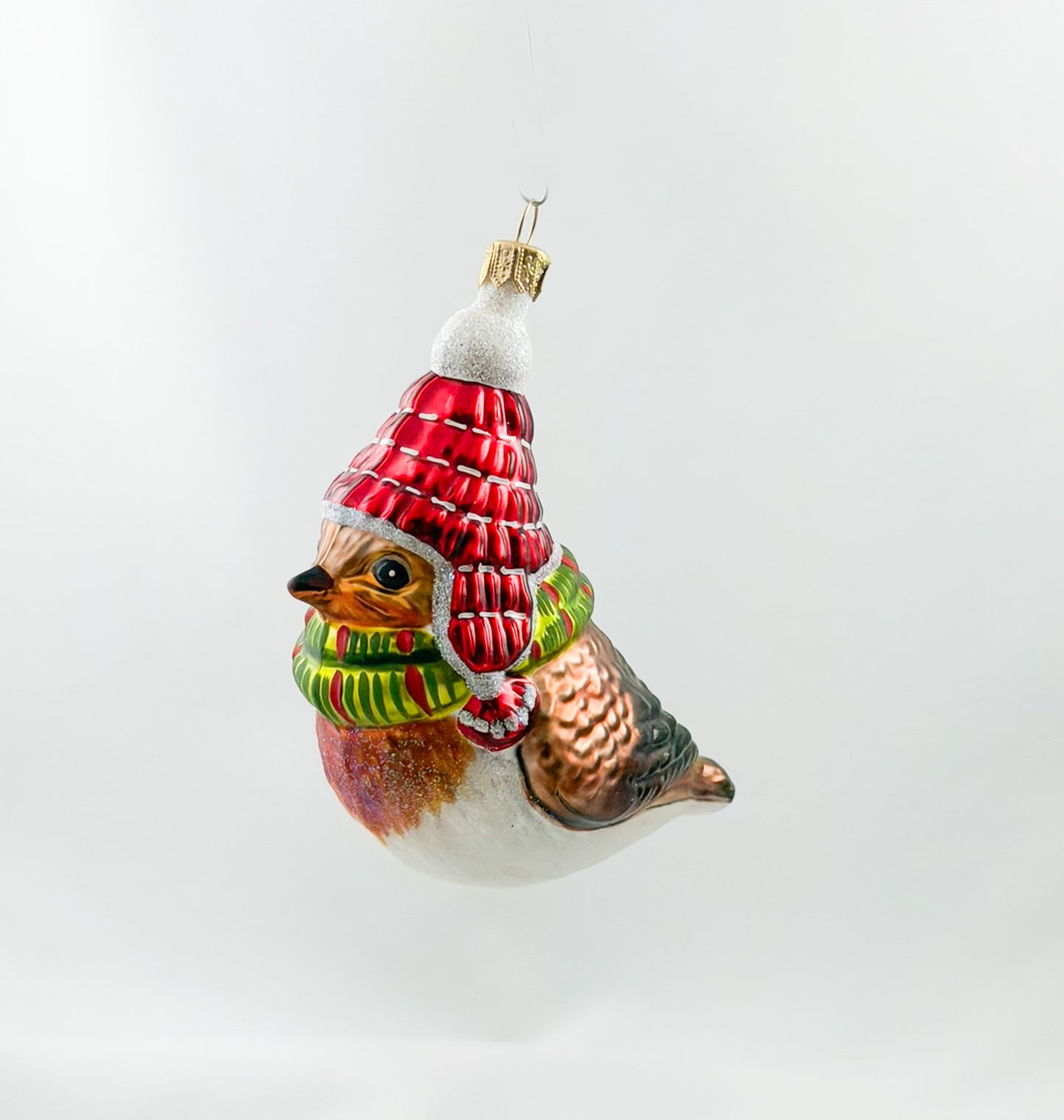 Robin with red hat and green scarf