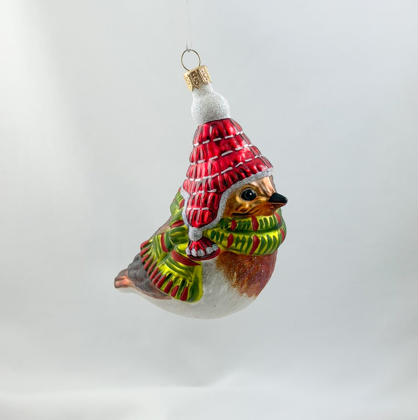 Robin with red hat and green scarf