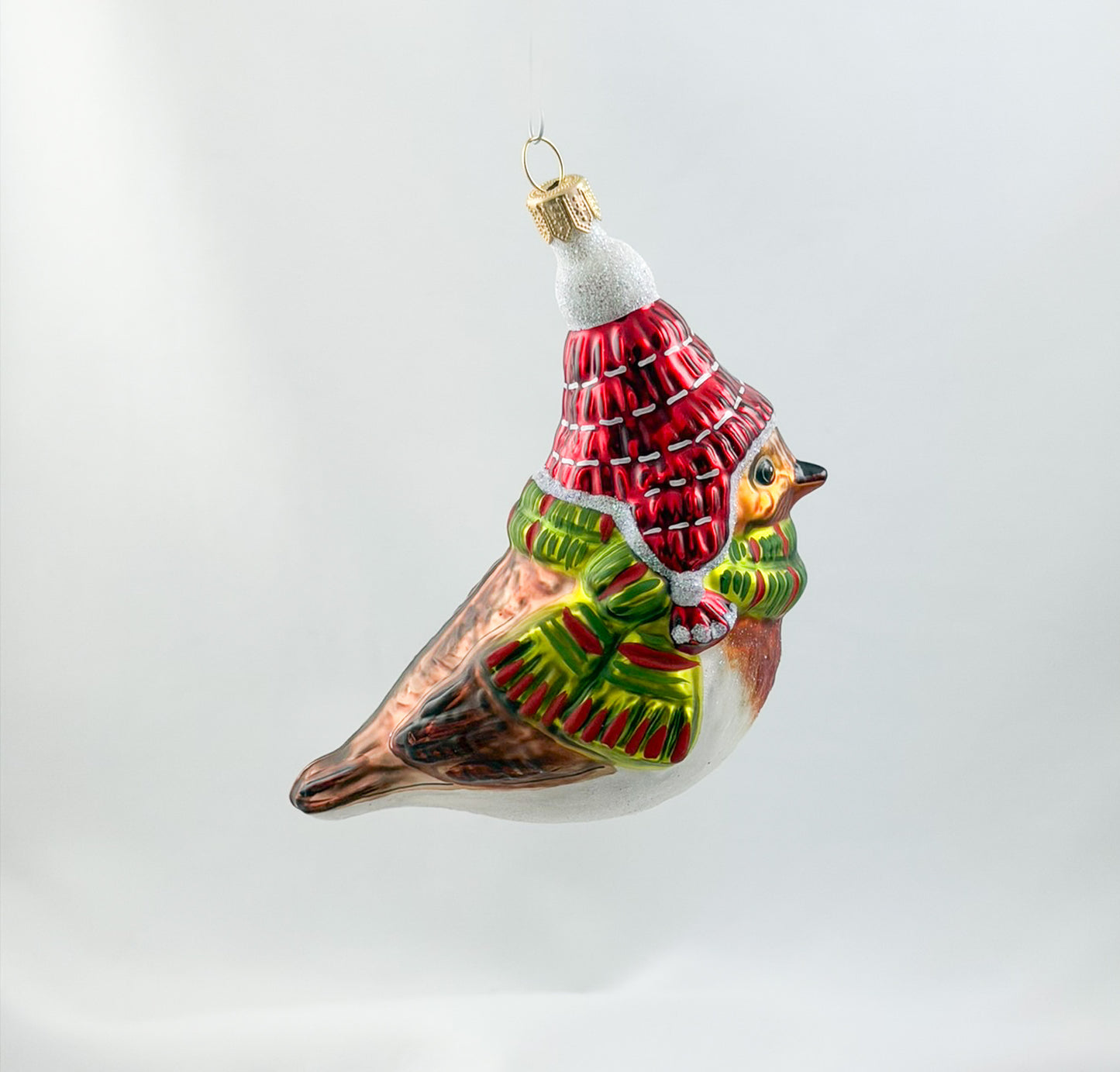 Robin with red hat and green scarf