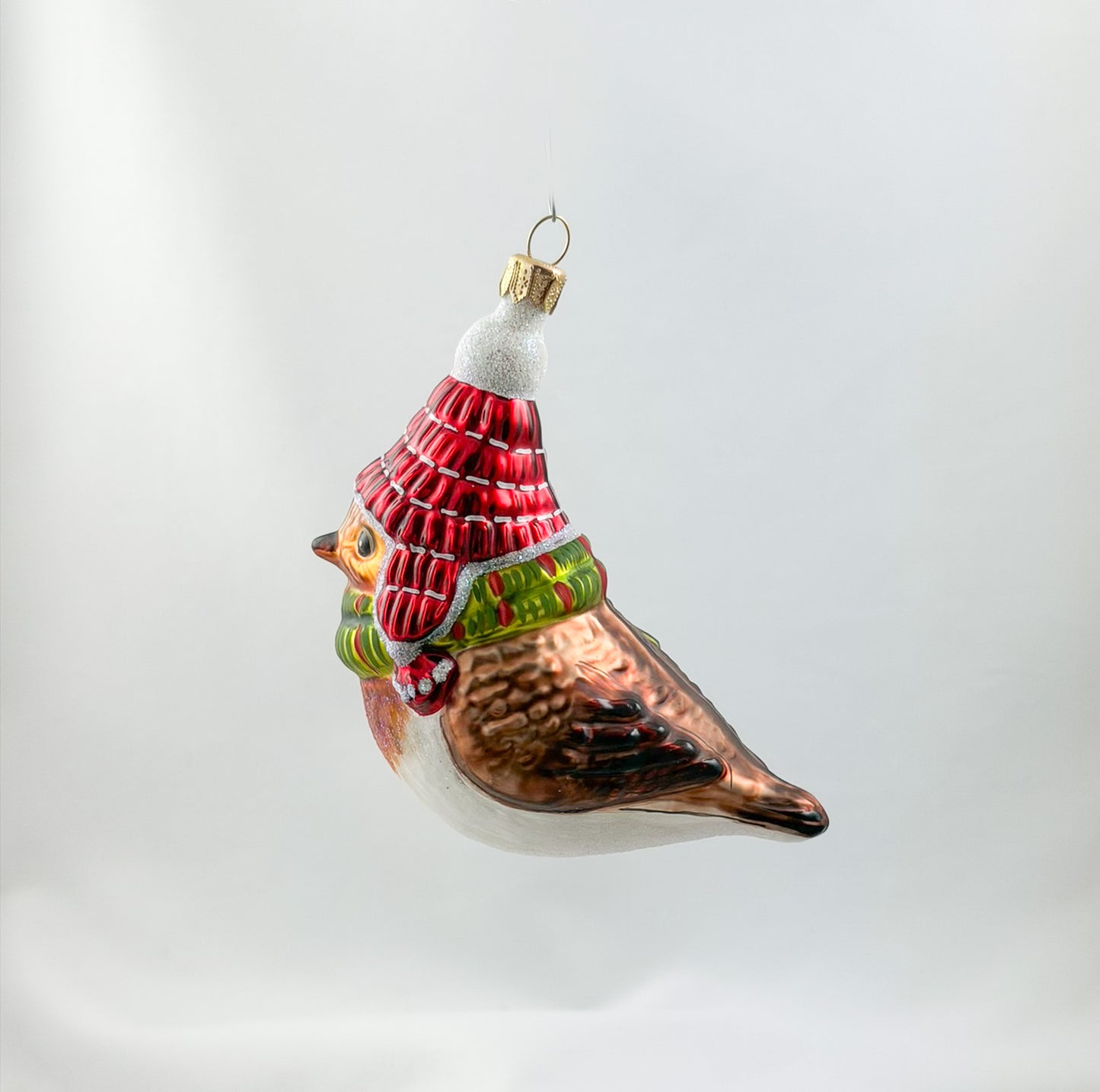 Robin with red hat and green scarf