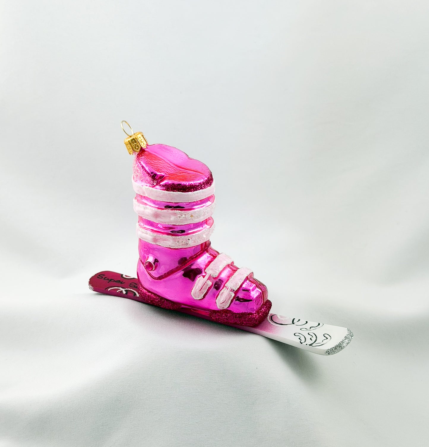 Pink ski boot with skis