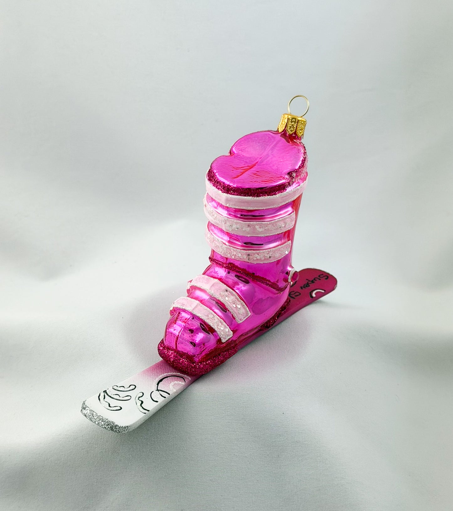Pink ski boot with skis