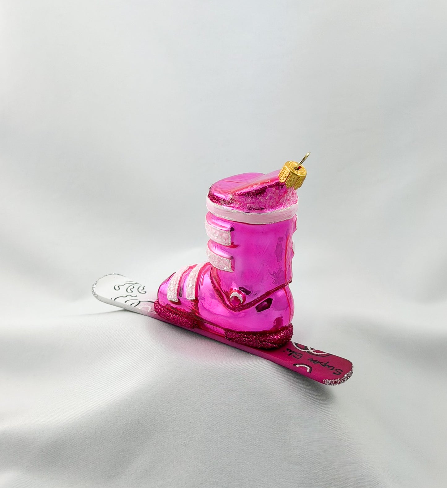Pink ski boot with skis