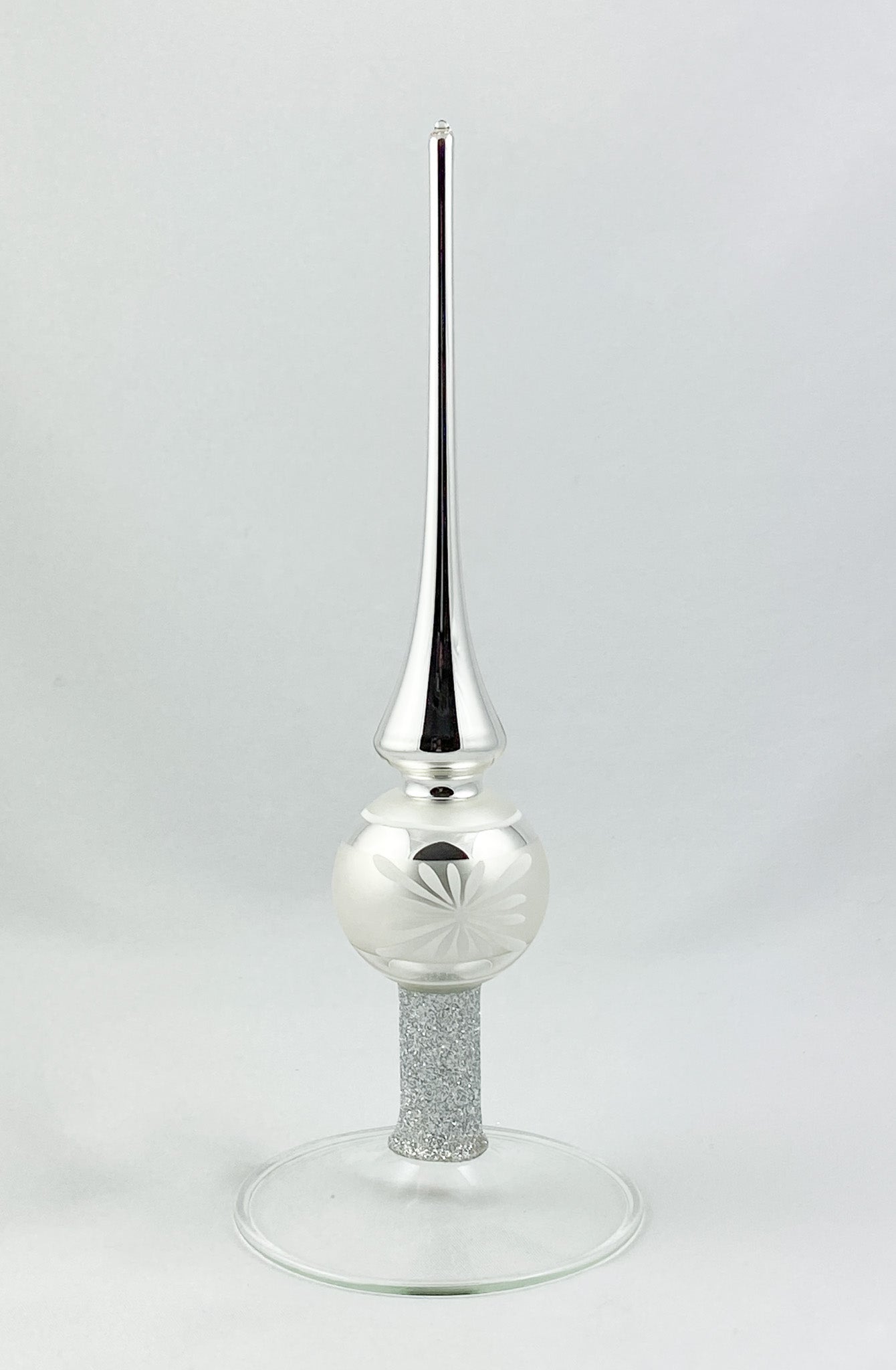 Silver tree topper with white flower motif