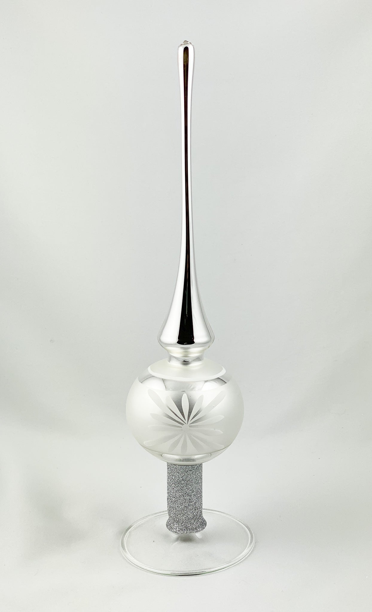 Silver tree topper with white flower motif