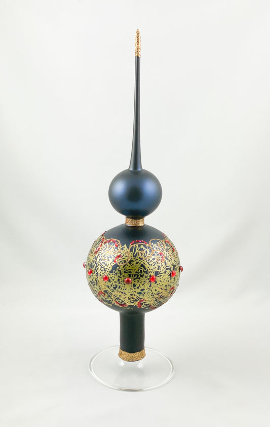 Dark blue tree topper with golden decoration and red gemstones