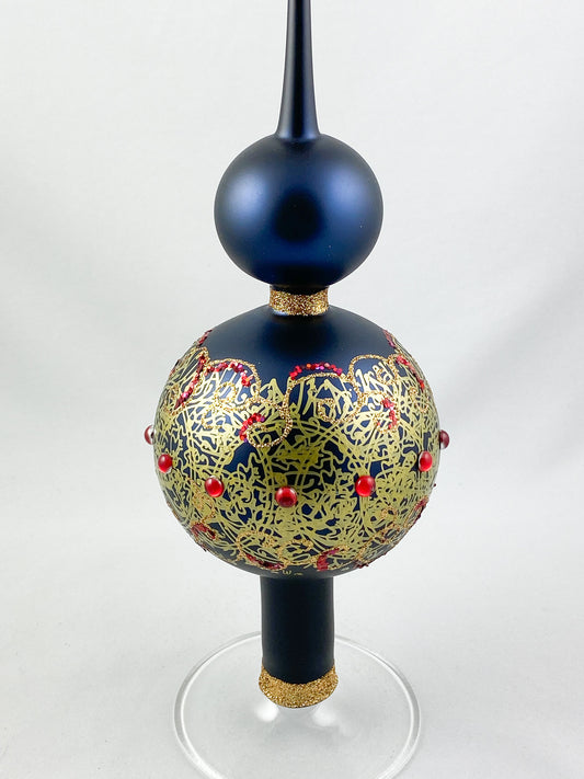 Dark blue tree topper with golden decoration and red gemstones