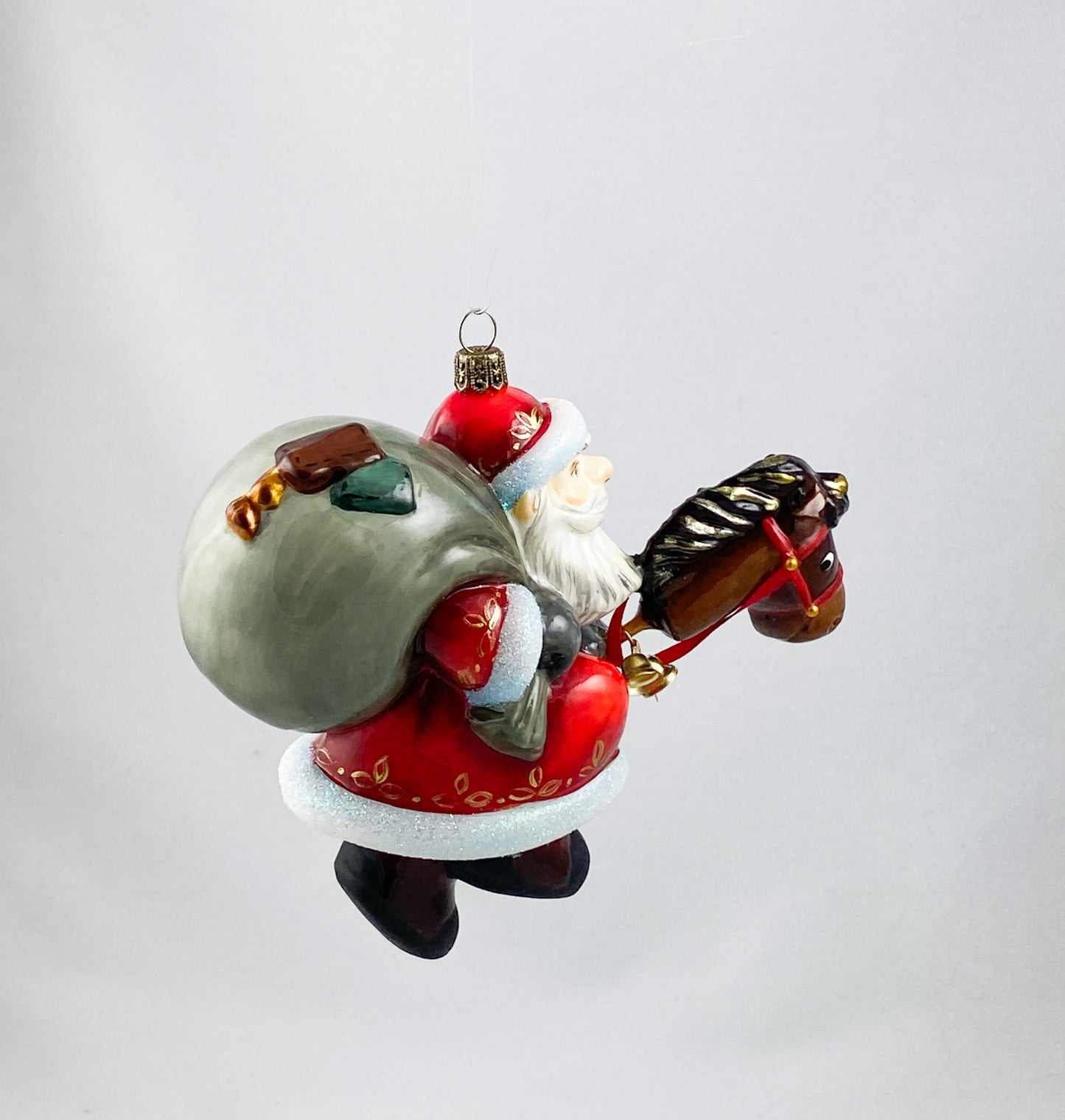 Father Frost brings the gifts with his stick horse AtlasArt