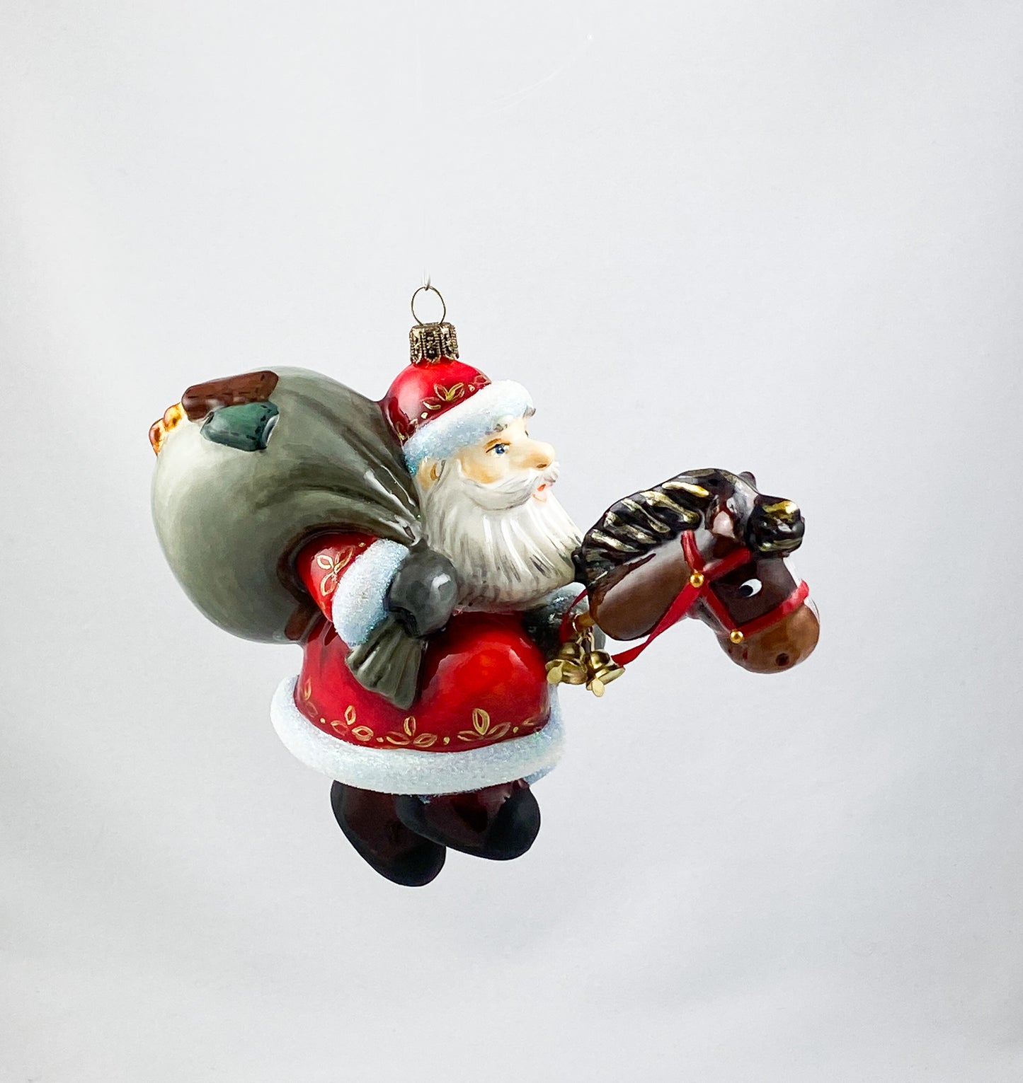 Father Frost brings the gifts with his stick horse AtlasArt