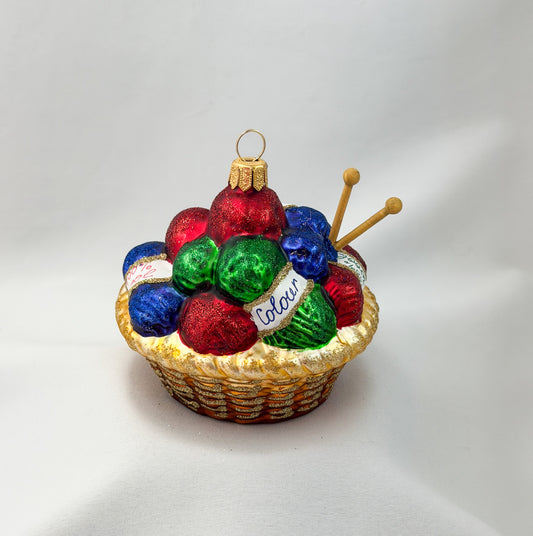 Knitted basket with many balls of wool