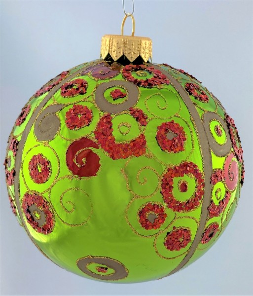 Grüne Kugel glänzend mit rotem Art-Deko Muster