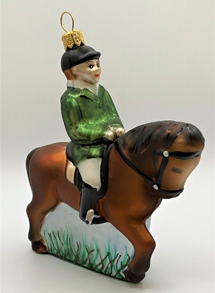 Reiterin auf braunem Pferd