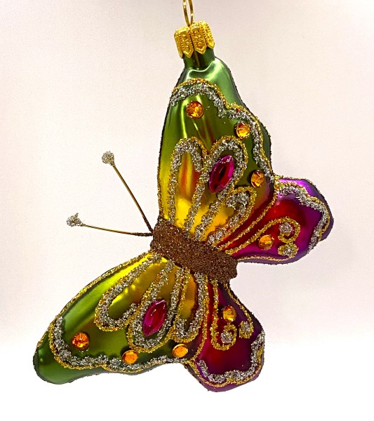 Schmetterling mit grün und pinken Flügeln mit Schmucksteinen