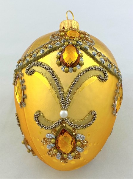 Goldens Faberge-Ei barock mit Volant und goldenen Schmucksteinen