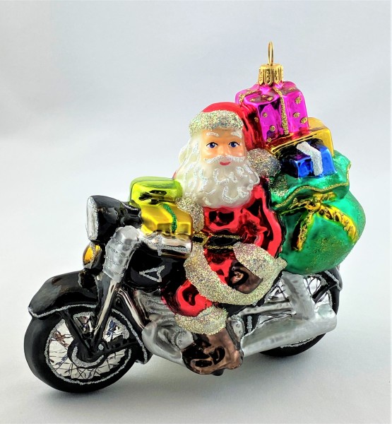 Santa kommt mit dem schwer beladenen Motorrad