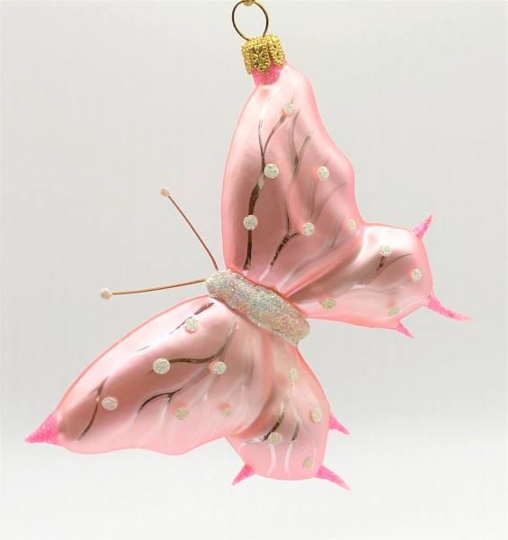 Rosa Schmetterling mit weissen Tupfen