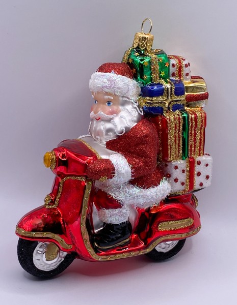 Santa Claus bringt die Geschenke mit dem Motor-Roller