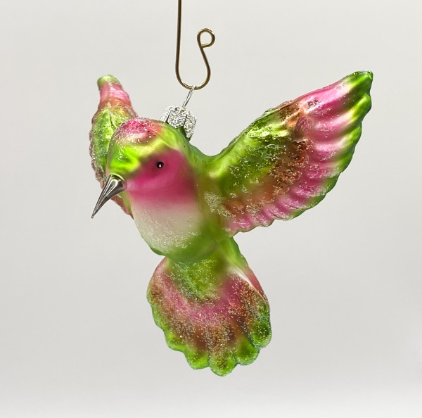 Kolibri fliegend grün und pink