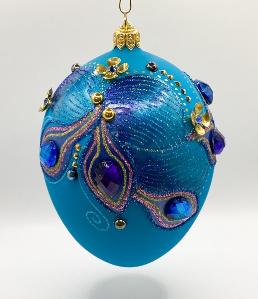 Eiform türkis mit blauen und violetten Schmucksteinen und metallenen Blüten Applikationen, GlitterLa