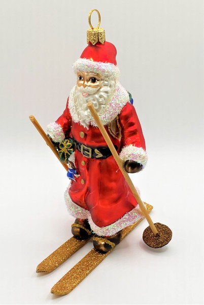 Weihnachtsmann auf Ski mit Geschenksack
