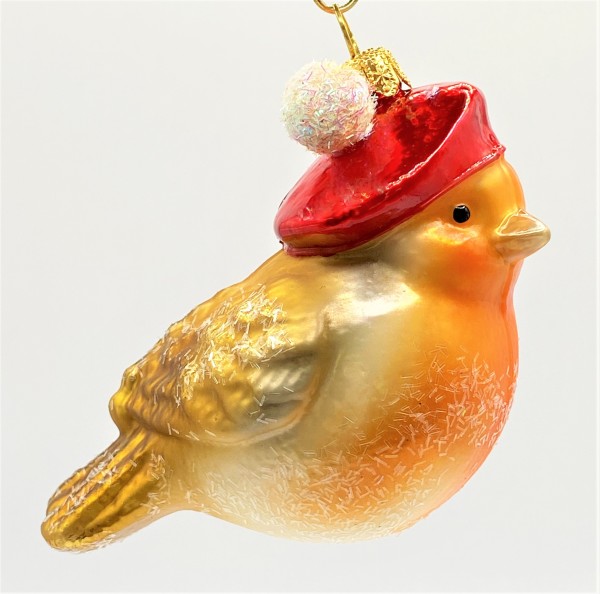 Hellbraunes Wintervögelchen mit roter Bommel-Mütze