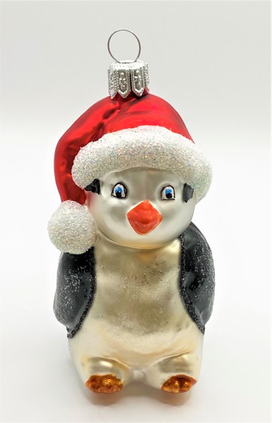 Pinguin mit roter Pudelmütze