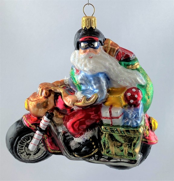 Santa Claus bringt die Geschenke auf dem coolen Motorrad