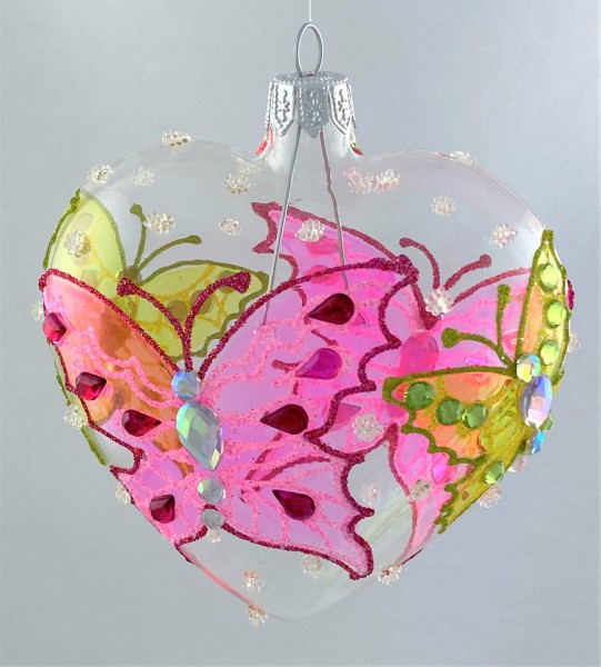 Transparentes Herz mit grünem und rosa Schmetterling