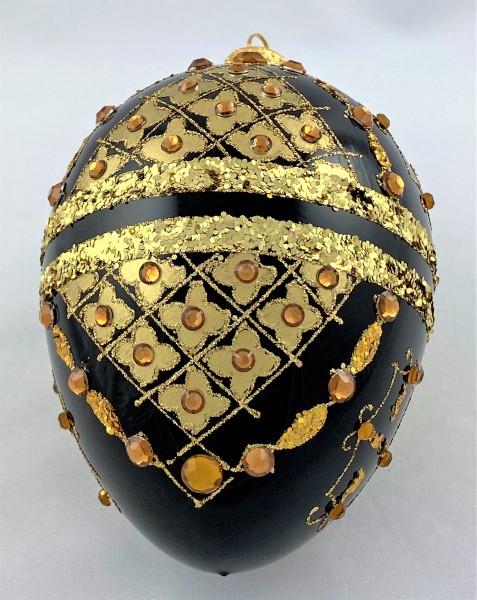 Faberge-Ei schwarz mit Golddekor mit Schmucksteinen