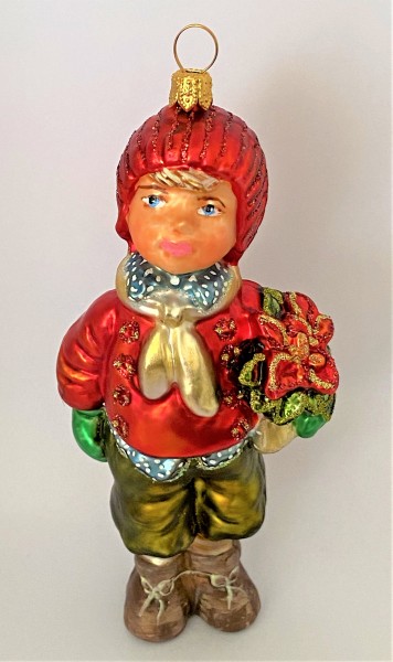 Junge mit roter Mütze und Weihnachtsstern unter dem Arm, KOMOZJA MOSTOWSKI