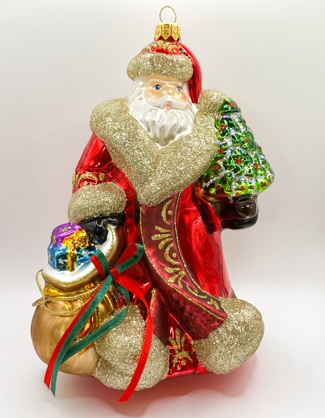 Weihnachtsmann in wallendem Mantel und braunem Geschenksack