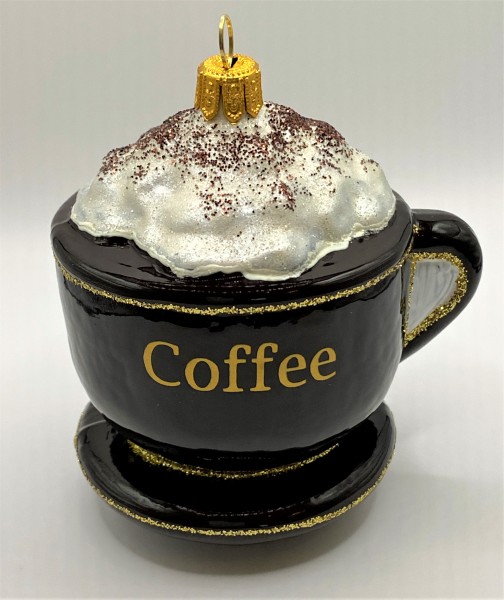 Kaffee mit Schlagsahn in brauner Tasse
