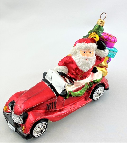 Santa bringt die Geschenke mit dem Oldtimer-Cabrio