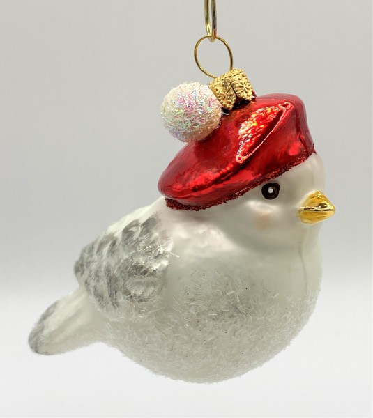 Weisses Wintervögelchen mit roter Bommel-Mütze
