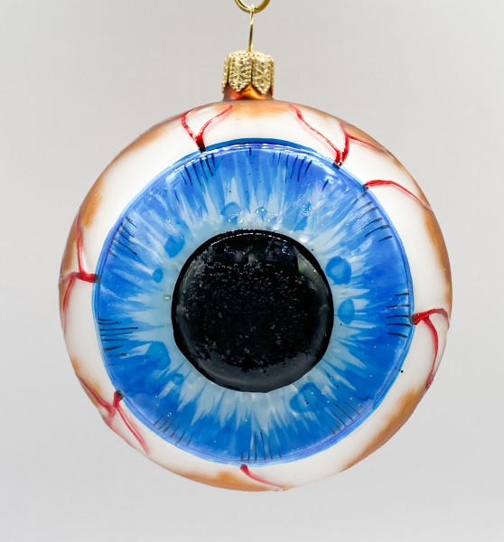 Anatomisches Auge mit blauer Iris und runder Pupille, braun