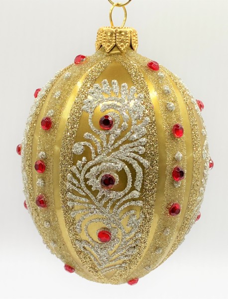 Ei-Form gold mit weissem Dekor und roten Schmucksteinen